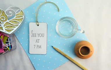 Text see you at seven pm on blue dot background