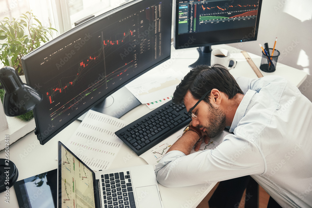 Poster i need to relax. tired young bearded trader in formal wear sleeping on the desk while working late i