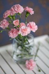 Fototapeta na wymiar Bouquet of carnations in a vase
