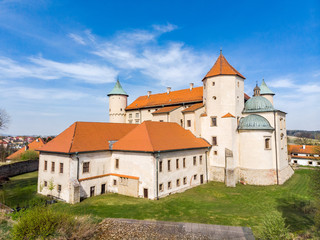 Fototapeta na wymiar Renaissance Castle on the hill in Nowy Wiśnicz, Poland, aerial drone view.