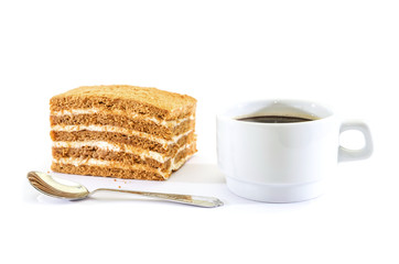 piece of cake and a cup of coffee on a white background