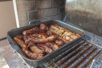 Baked meat pan cooked on the grill