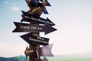 Pointers point to different directions. Russian text sochi minsk canary islands
