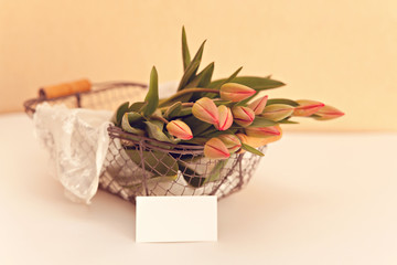 Fresh tulups bouquet in basket
