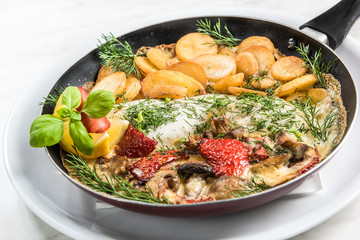 Grilled fish with fried potatoes, restaurant serving dish