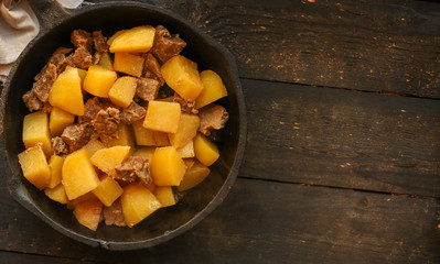 goulash, stewed potatoes with meat. stewed main course. food background. top