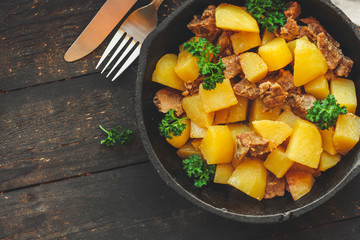 goulash, stewed potatoes with meat. stewed main course. food background. top