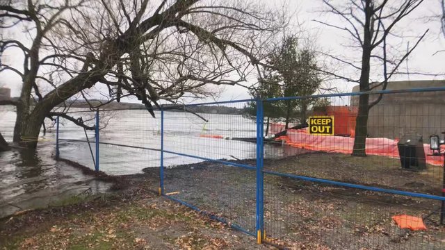 Keep out sign on fence building off Ottawa River flood 2019.