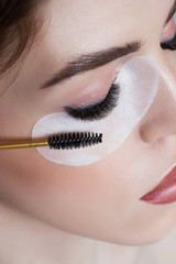Closeup portrait of girl with lashes. Long beautiful eyelashes and perfect skin. Photo for beauty salon