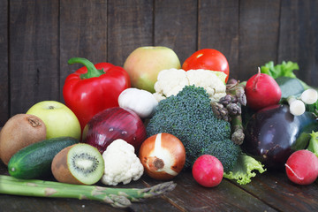 Various colorful vegetables on old wooden table. Healthy, detox diet concept.