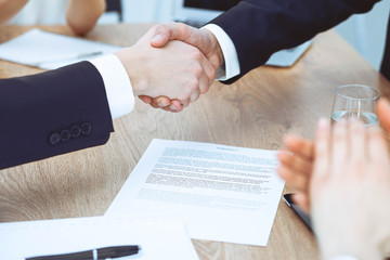 Business people shaking hands at meeting or negotiation in the office. Handshake concept. Partners are satisfied because signing contract