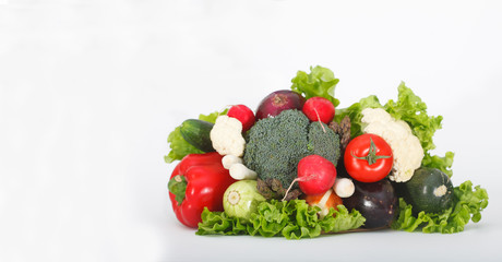 Obraz na płótnie Canvas Bouquet of various vegetables. Healthy lifestyle, a detox diet. Colorful vegetables on white background with copy space.