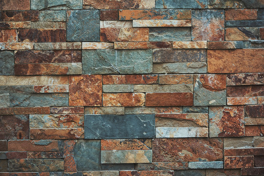 Urban Stone Wall Texture Background. Teal And Orange Colors.