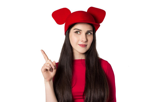 White Black Haired Beautiful Young Woman With Mouse Ears Hat And Rised Index Finger