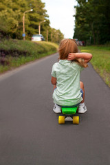 Little girl on a skateboard