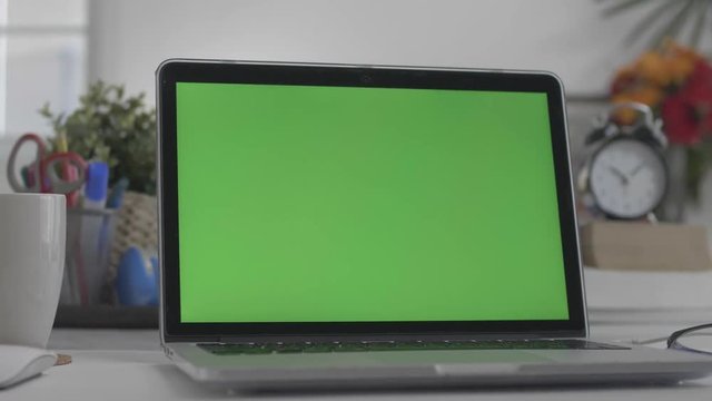 Laptop Green Screen, Home office, Dolly shot. Chroma Key laptop.