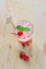 Strawberry water on the wooden floor.