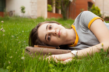 college students relaxing at campus yard