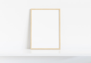 Wooden frame leaning on white shelve in bright interior mockup 3D rendering