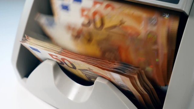 Flow of euro bills going through the counting mechanism