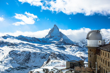The Matterhorn is a pyramidal shaped mountain of the Swiss Alps, standing at the border between...