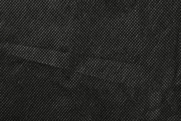 Synthetic black nylon fabric, cloth texture background