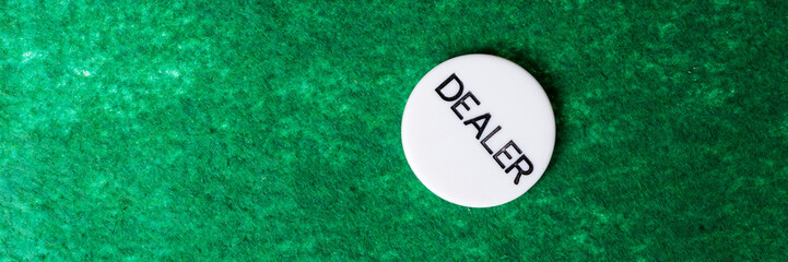Green poker table background with white chip dealer