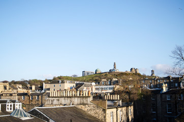 Fototapeta na wymiar Rooftops and Monuments on Calton Hill, Edinburgh