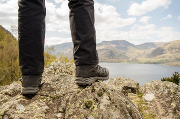 Hikers Legs and Shoes with Countryside in Distance