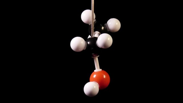 Ethanol C2H6O molecule rotating on black background