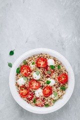 Healthy Bowl Salad with Quinoa, Mozzarella Cheese, Tomatoes and Basil