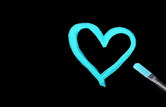 Bright Blue Heart Shape Painted With Watercolors On Black Paper