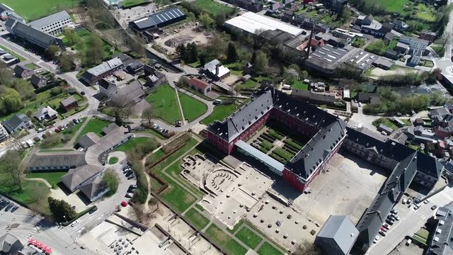Aerial bird view footage flight around Abbey of Stavelot located in the Walloon municipality in Belgian province of Liege at Ardennes region popular tourist destination know by beautiful nature 4k