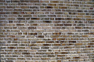 High resolution close up aged and weathered brick walls with red and yellow colored bricks