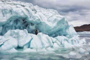 Fototapeta na wymiar Rocks covered with ice on Lake Baikal in winter