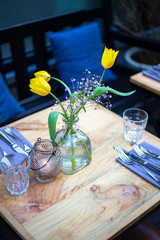 Table set, flowers in a vase