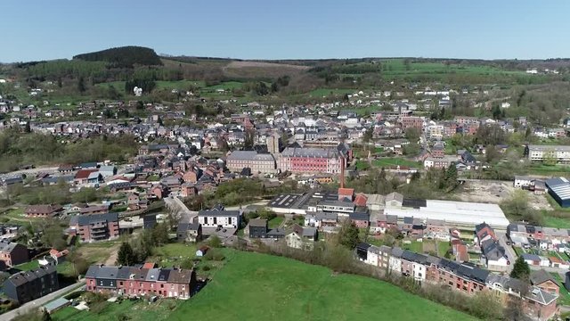 Aerial bird view footage flight towards Abbey of Stavelot located in the Walloon municipality in Belgian province of Liege at Ardennes region popular tourist destination know by beautiful nature 4k