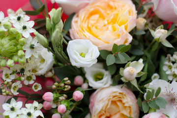 beautiful spring various flowers of delicate pink white and yellow shades in a large bouquet on top