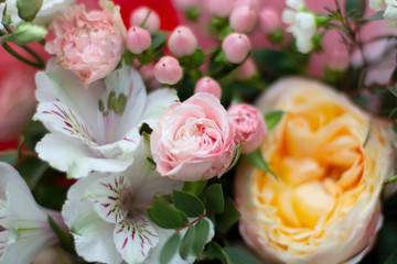 light pink, white and yellow flowers in a bouquet from above