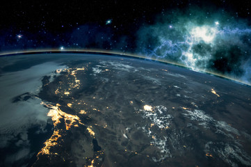 Picture of Earth in space, stars all around, night sky. Elements of this image furnished by NASA.