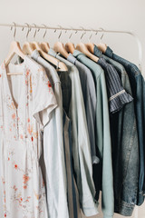 Feminine clothes on hanger. Minimal fashion composition on white background.