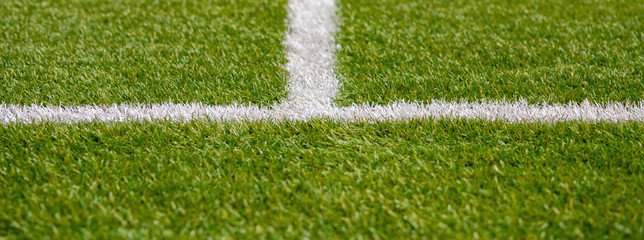 Texture of artificial grass herb cover sports field. It is used in different sports: football,...