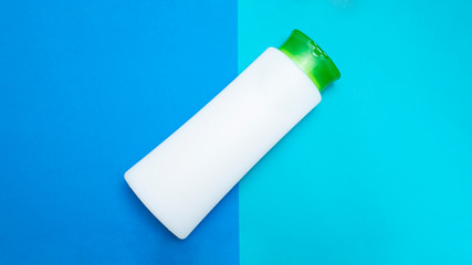 Cosmetic Product. White balm, cream or lotion. Blue background. Copy space.
