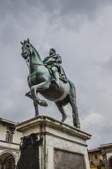 Fototapeta na wymiar Statue of Ferdinando I de' Medici at he Piazza della Santissima Annunziata in Florence, Italy 