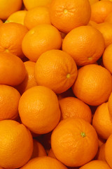 Ripe mandarines on the market. Mandarin orange background.