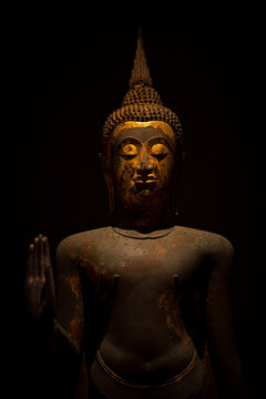 A Standing Buddha image used as amulets of Buddhism religion