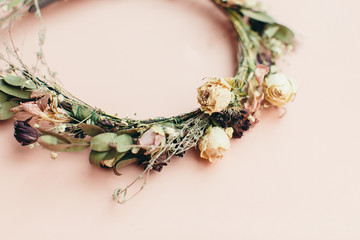 dried wreath of flowers on a pink background (wedding)