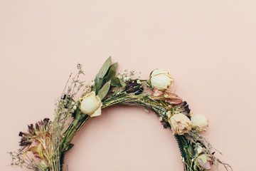 dried wreath of flowers on a pink background (wedding)