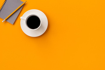 space orange vintage notebook with coffee and pencil