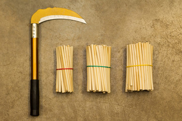 Yellow sickle on concrete floor